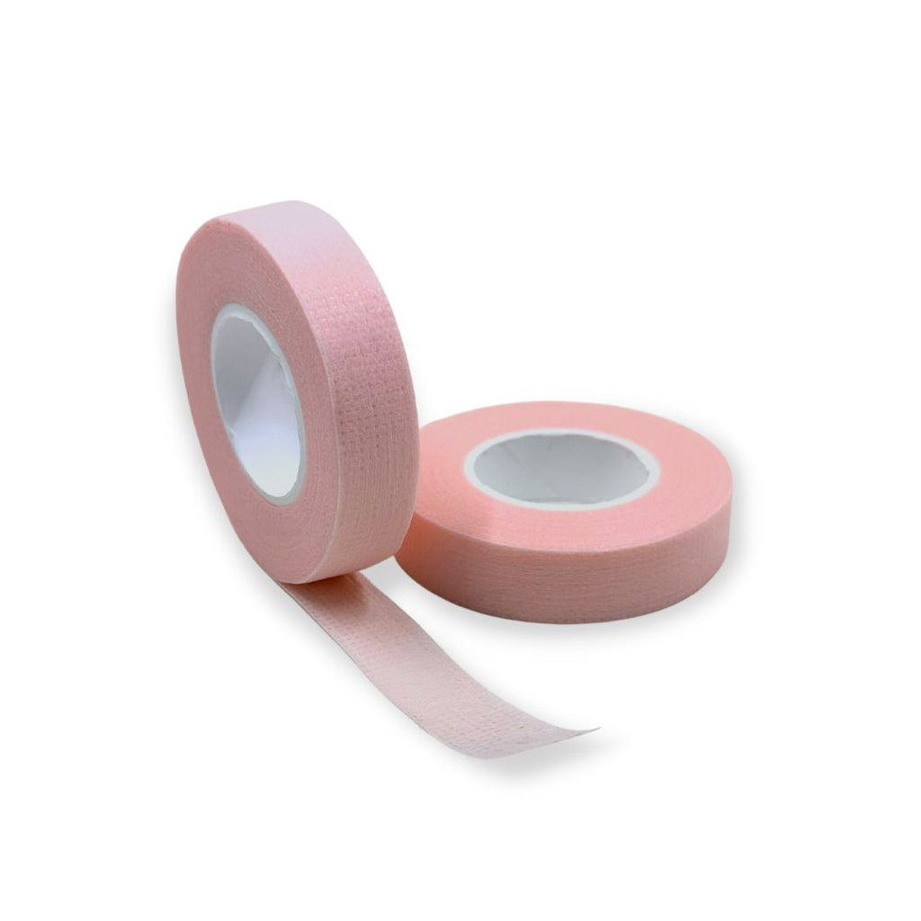 Variety of pink tapes for sensitive skin arranged neatly, showing different sizes and packages