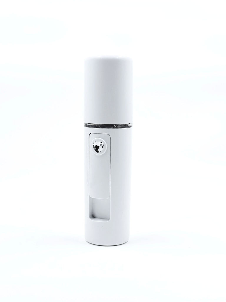 Image of a portable Nano Mister device emitting a fine mist, perfect for on-the-go skin hydration