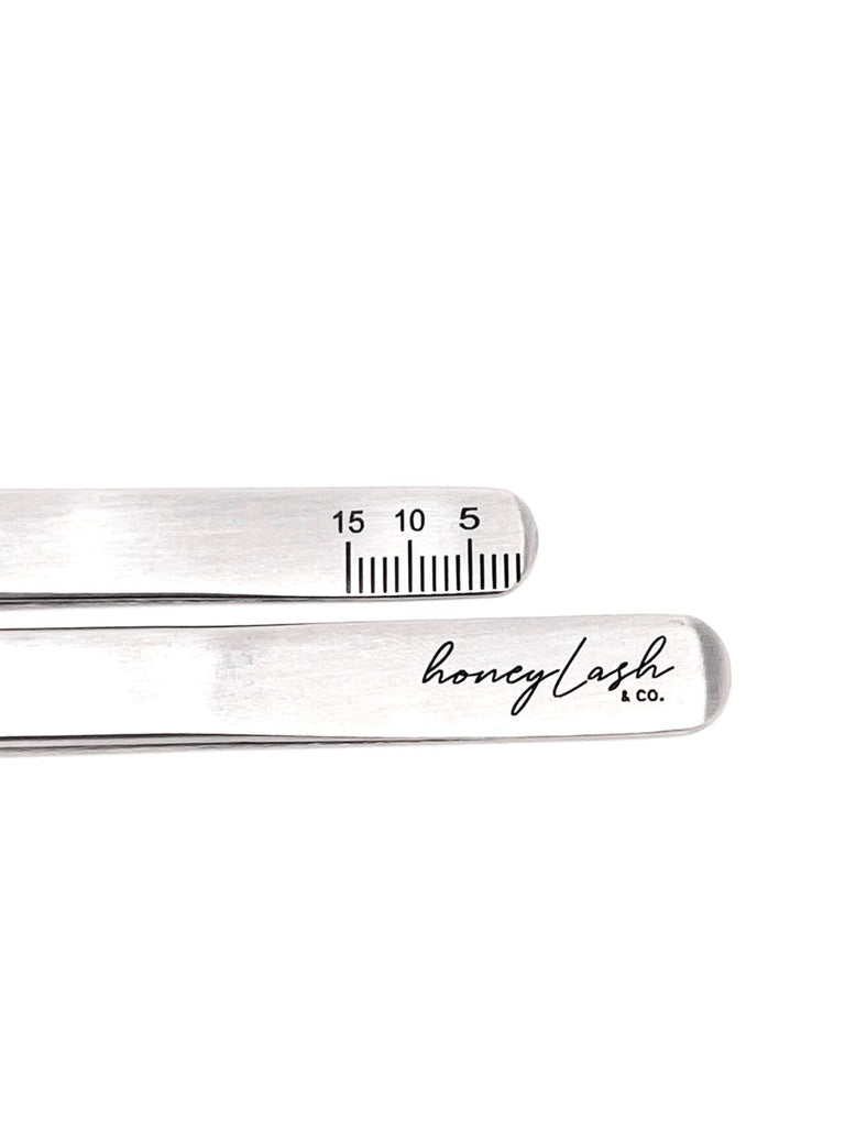 Ergonomic isolation curved tweezer designed for comfort and precision, showcased on a velvet cushion